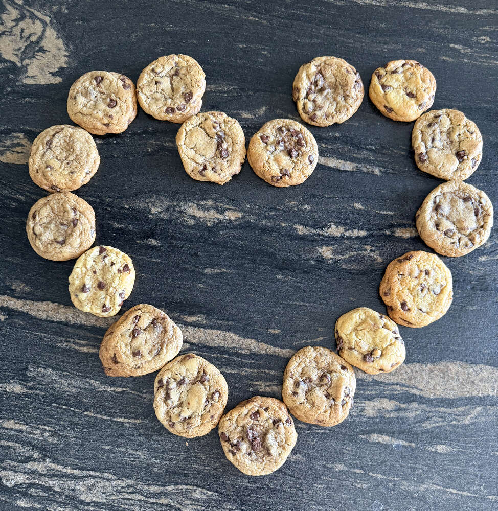 Chocolate chip cookies arranged in a heart shape
